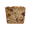Close up image of a single slice of the nut, seed, grain and fruit loaf. Displayed on white background with all the nuts, seeds, grains & fruit clearly visible.